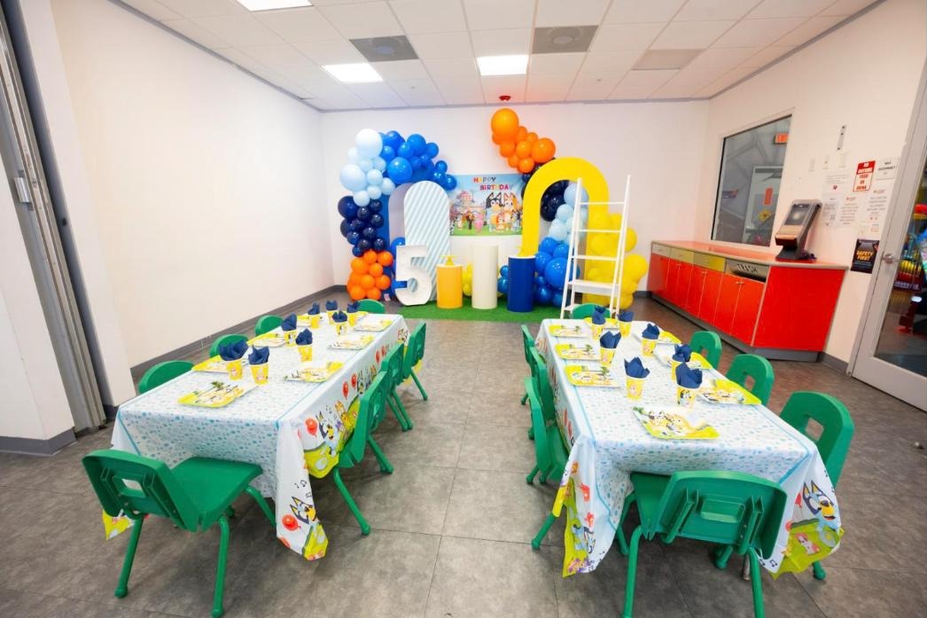 Birthday party room decorated with balloons at Rocket World Pembroke Pines